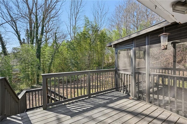 deck with a sunroom