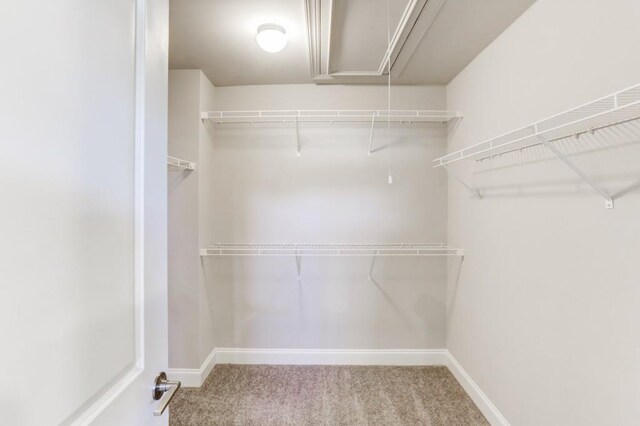 full bathroom featuring tiled shower / bath, vanity, and toilet