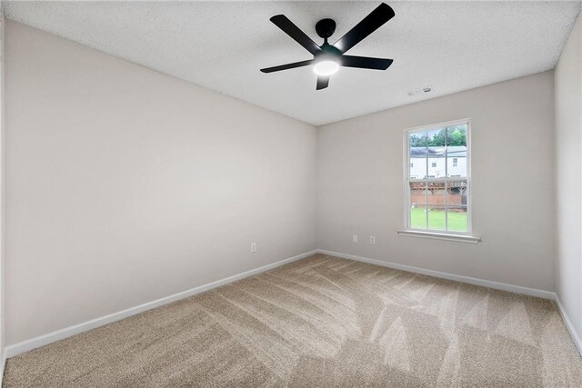 89 Prospect Path, Hiram, GA 30141 - carpeted spare room with baseboards, a ceiling fan, and a textured ceiling