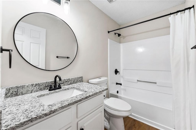 89 Prospect Path, Hiram, GA 30141 - full bathroom with vanity, shower / tub combo, toilet, wood finished floors, and a textured ceiling