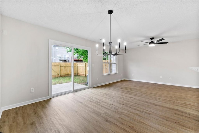 89 Prospect Path, Hiram, GA 30141 - unfurnished dining area featuring wood finished floors, a chandelier, baseboards, ceiling fan, and a textured ceiling