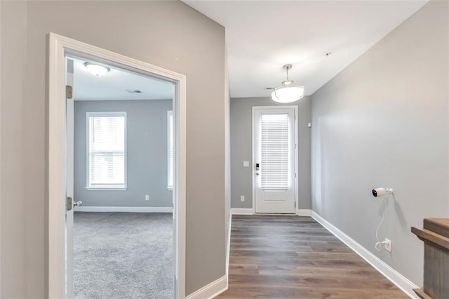 foyer entrance with dark hardwood / wood-style flooring