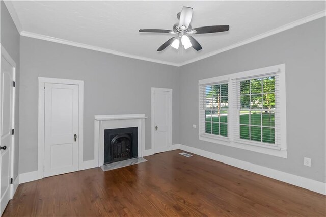 unfurnished living room featuring ornamental molding, baseboards, a fireplace with flush hearth, and wood finished floors