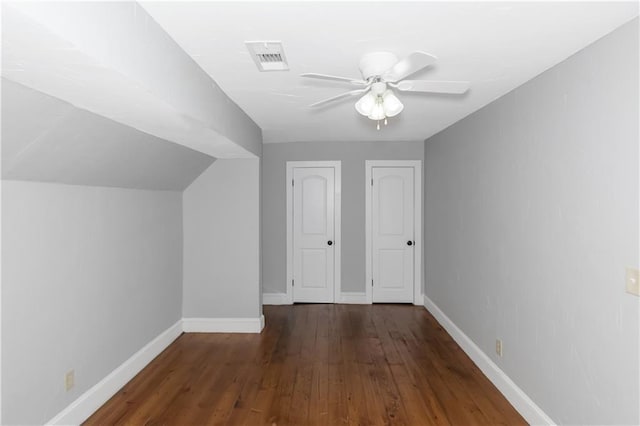 bonus room featuring lofted ceiling, visible vents, a ceiling fan, wood finished floors, and baseboards