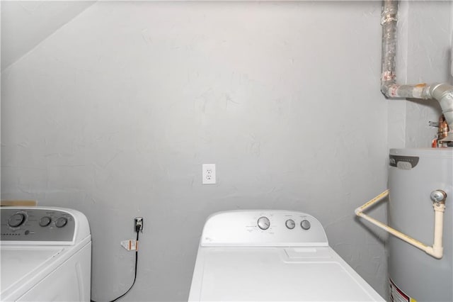 laundry area featuring laundry area, gas water heater, and washing machine and dryer