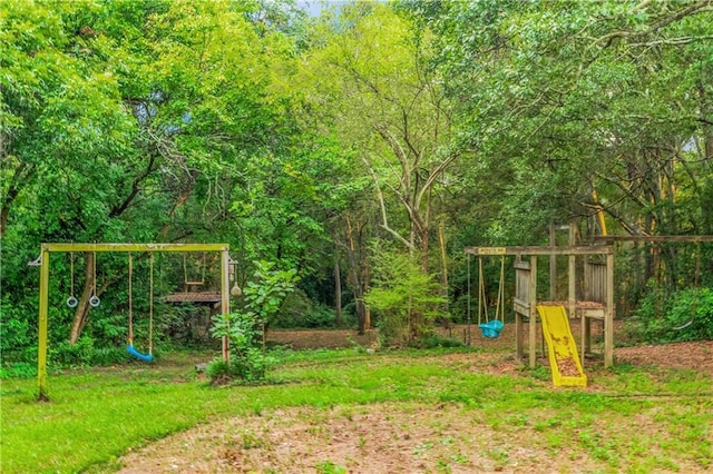 view of play area with a wooded view