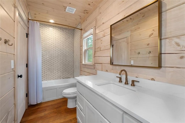 full bathroom with shower / bathtub combination with curtain, toilet, wood finished floors, wooden ceiling, and vanity