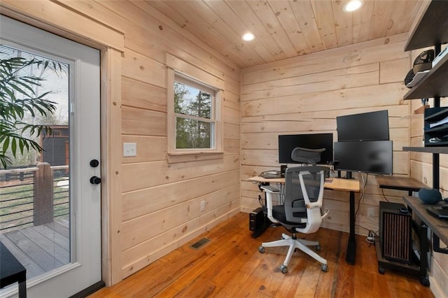 home office featuring hardwood / wood-style floors, wooden walls, recessed lighting, and wood ceiling