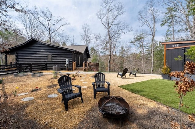 view of yard with an outdoor fire pit