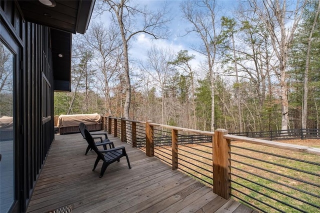 deck featuring a view of trees