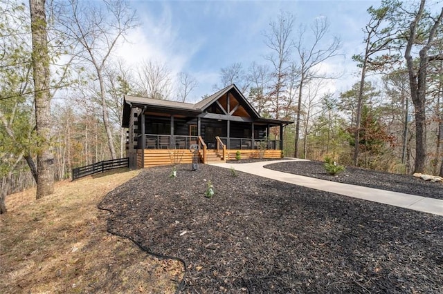 cabin featuring covered porch