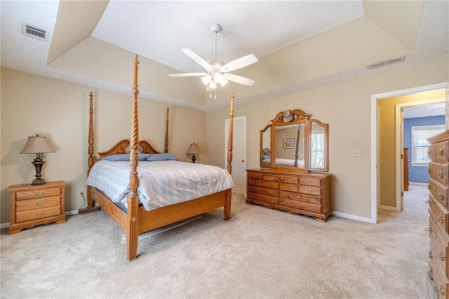 45 Somerset Ct, Covington, GA 30016 - bedroom featuring a tray ceiling, baseboards, visible vents, a ceiling fan, and light carpet