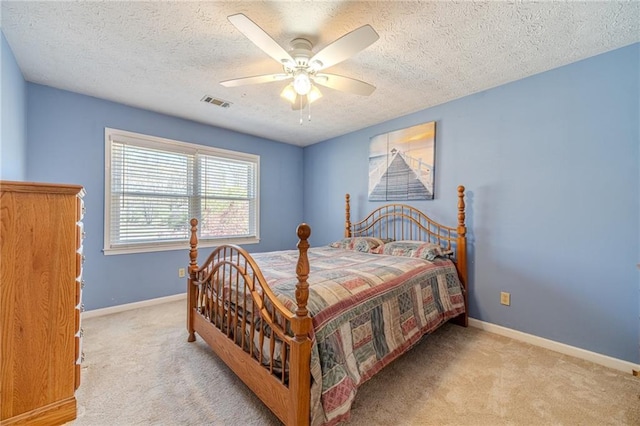 45 Somerset Ct, Covington, GA 30016 - carpeted bedroom featuring baseboards, visible vents, a textured ceiling, and a ceiling fan