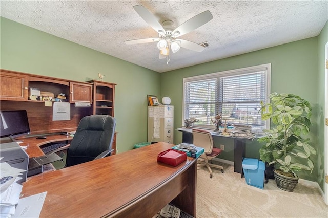 45 Somerset Ct, Covington, GA 30016 - office area featuring a textured ceiling, visible vents, baseboards, a ceiling fan, and light carpet