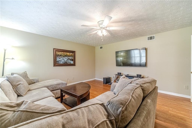 45 Somerset Ct, Covington, GA 30016 - living area featuring baseboards, ceiling fan, visible vents, and light wood-type flooring