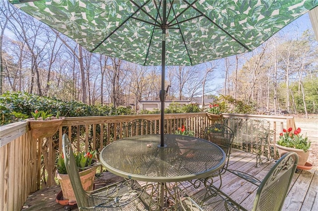 45 Somerset Ct, Covington, GA 30016 - wooden terrace featuring outdoor dining space