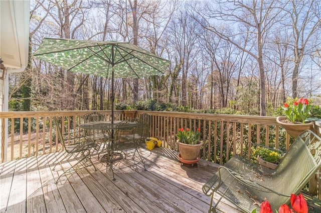 45 Somerset Ct, Covington, GA 30016 - wooden terrace featuring outdoor dining space