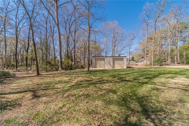 45 Somerset Ct, Covington, GA 30016 - view of yard with a detached garage and an outdoor structure