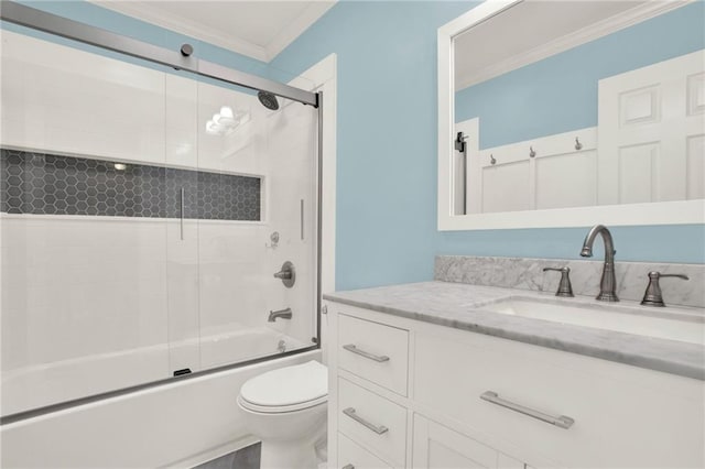 full bathroom featuring toilet, vanity, bath / shower combo with glass door, and ornamental molding