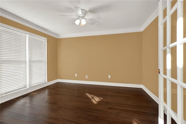 unfurnished room featuring ceiling fan, dark wood-type flooring, and ornamental molding