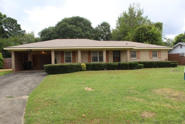 single story home featuring a front yard and a carport