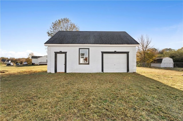 garage with a lawn