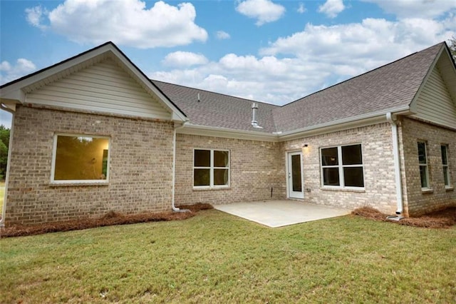 960 Park Place St, Social Circle, GA 30025 - back of property featuring brick siding, a patio area, a shingled roof, and a lawn