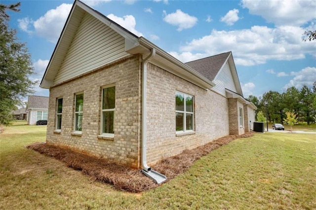 960 Park Place St, Social Circle, GA 30025 - view of side of home with brick siding, a yard, and cooling unit
