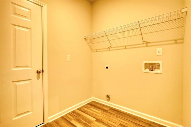 960 Park Place St, Social Circle, GA 30025 - washroom with hookup for an electric dryer, wood finished floors, baseboards, and hookup for a washing machine