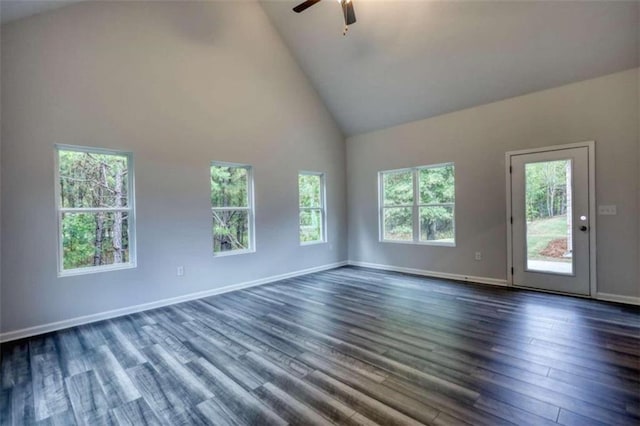 960 Park Place St, Social Circle, GA 30025 - spare room with a ceiling fan, high vaulted ceiling, dark wood-type flooring, and baseboards