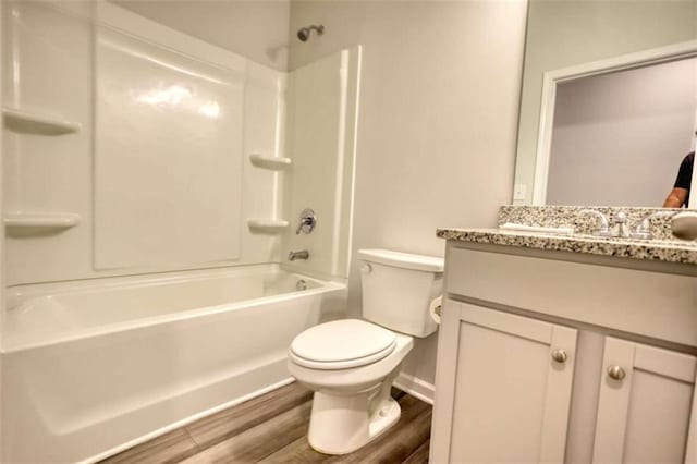 960 Park Place St, Social Circle, GA 30025 - full bath featuring vanity, bathing tub / shower combination, toilet, wood finished floors, and baseboards