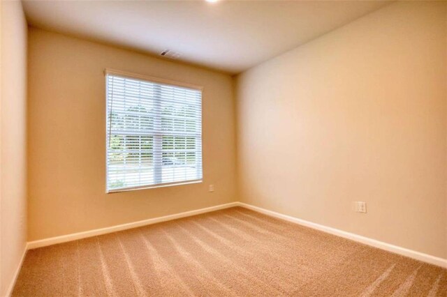 960 Park Place St, Social Circle, GA 30025 - spare room featuring carpet flooring and baseboards