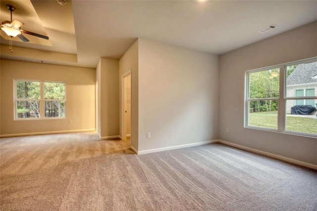 960 Park Place St, Social Circle, GA 30025 - carpeted spare room with baseboards, a ceiling fan, and a tray ceiling