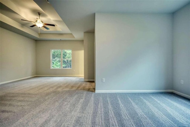 960 Park Place St, Social Circle, GA 30025 - unfurnished room with carpet, baseboards, a tray ceiling, and ceiling fan