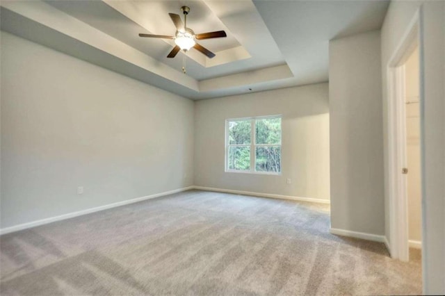 960 Park Place St, Social Circle, GA 30025 - carpeted spare room featuring baseboards, ceiling fan, and a raised ceiling