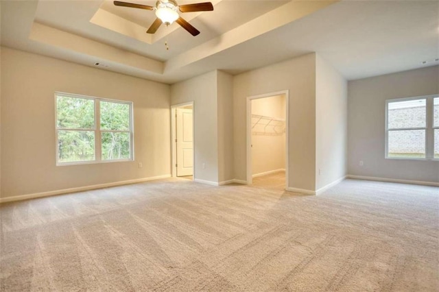 960 Park Place St, Social Circle, GA 30025 - unfurnished bedroom with a raised ceiling, baseboards, carpet floors, a spacious closet, and ceiling fan