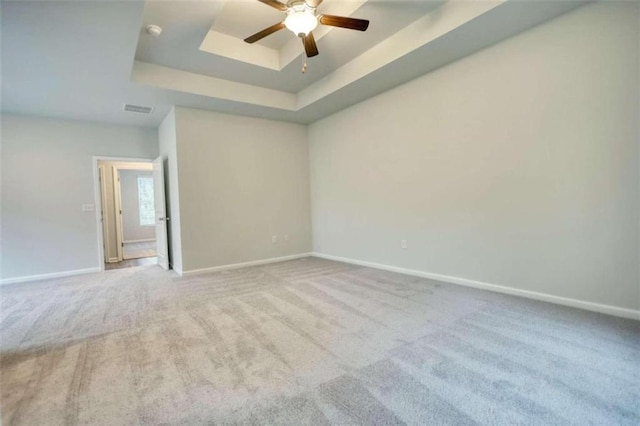 960 Park Place St, Social Circle, GA 30025 - unfurnished room featuring a raised ceiling, carpet, baseboards, and a ceiling fan