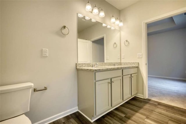 960 Park Place St, Social Circle, GA 30025 - full bath featuring double vanity, baseboards, toilet, and wood finished floors