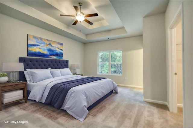 960 Park Place St, Social Circle, GA 30025 - carpeted bedroom featuring baseboards, a raised ceiling, and a ceiling fan