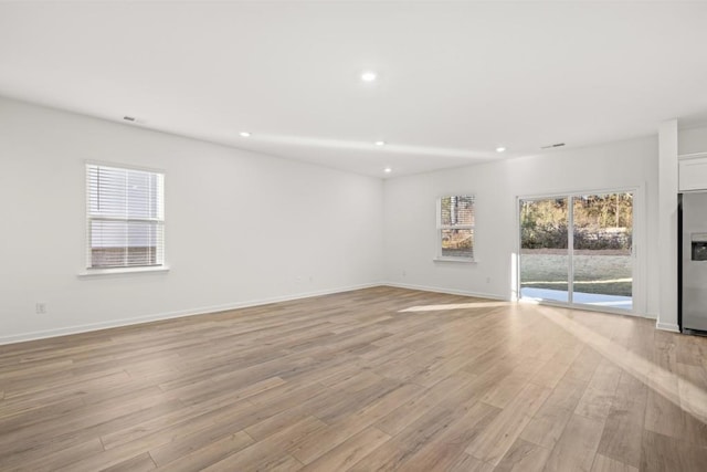 unfurnished room featuring light hardwood / wood-style flooring