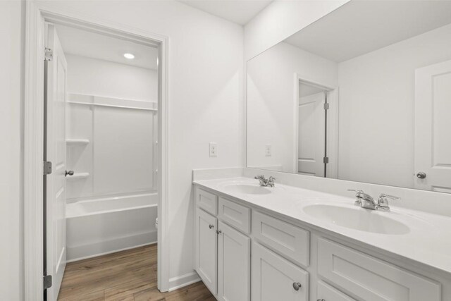 bathroom with hardwood / wood-style flooring and vanity