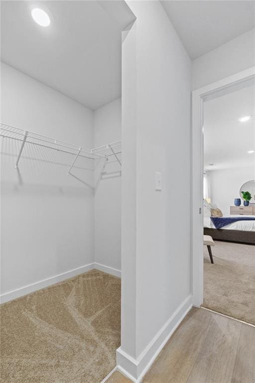 spacious closet featuring hardwood / wood-style flooring