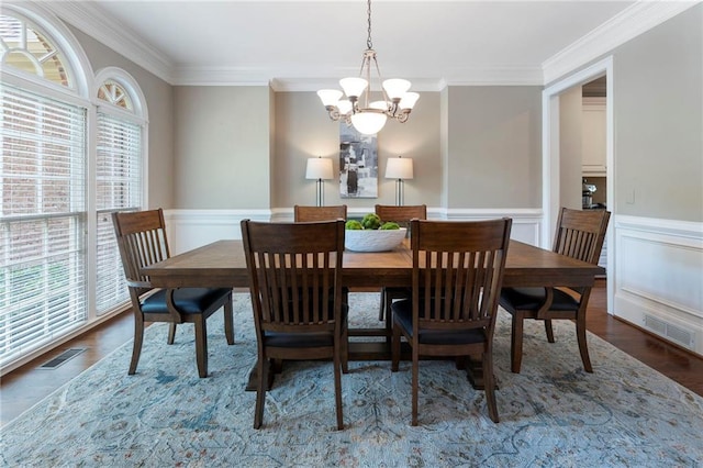 10135 High Falls Pointe Pointe, Johns Creek, GA 30022 - dining room with a chandelier, crown molding, wood finished floors, and a wainscoted wall