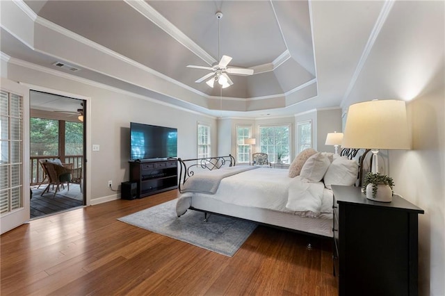 10135 High Falls Pointe Pointe, Johns Creek, GA 30022 - bedroom with a raised ceiling, wood finished floors, access to exterior, baseboards, and crown molding