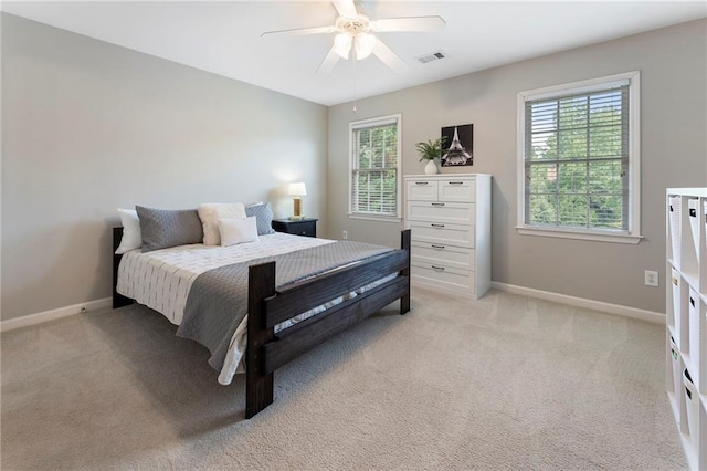 10135 High Falls Pointe Pointe, Johns Creek, GA 30022 - bedroom featuring multiple windows, baseboards, and light colored carpet