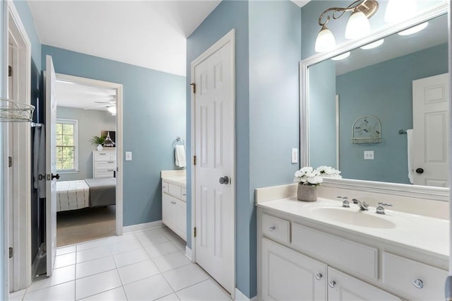 10135 High Falls Pointe Pointe, Johns Creek, GA 30022 - full bath with vanity, connected bathroom, tile patterned flooring, a ceiling fan, and baseboards