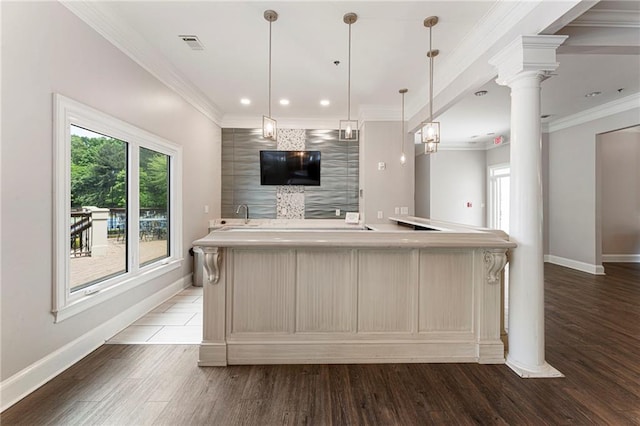 10135 High Falls Pointe Pointe, Johns Creek, GA 30022 - kitchen featuring baseboards, light countertops, light wood finished floors, ornate columns, and recessed lighting