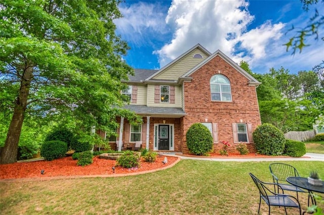 view of front of house featuring brick siding