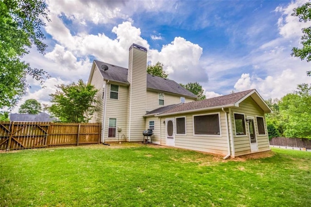 rear view of property with a chimney