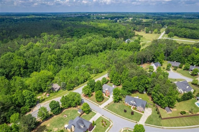 view of property location featuring a heavily wooded area